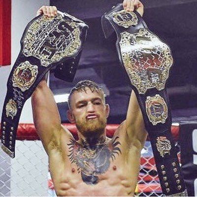 Conor Mcgregor With Two Ufc Belts.