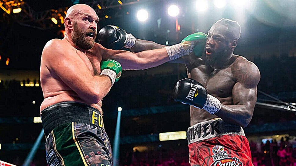 Tyson Fury And Deontay Wilder Punching During Their Third Fight.